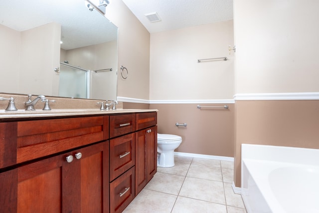 2786 Willow Bend Ct, Crestview, FL 32539 - full bath with a garden tub, double vanity, tile patterned floors, a textured ceiling, and a shower with shower door