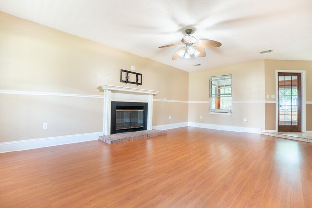 2786 Willow Bend Ct, Crestview, FL 32539 - unfurnished living room featuring plenty of natural light, ceiling fan, light wood-style floors, and a glass covered fireplace