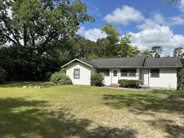 308 S Depot St, Bonifay, FL 32425 - ranch-style house featuring entry steps, a front yard, and a chimney