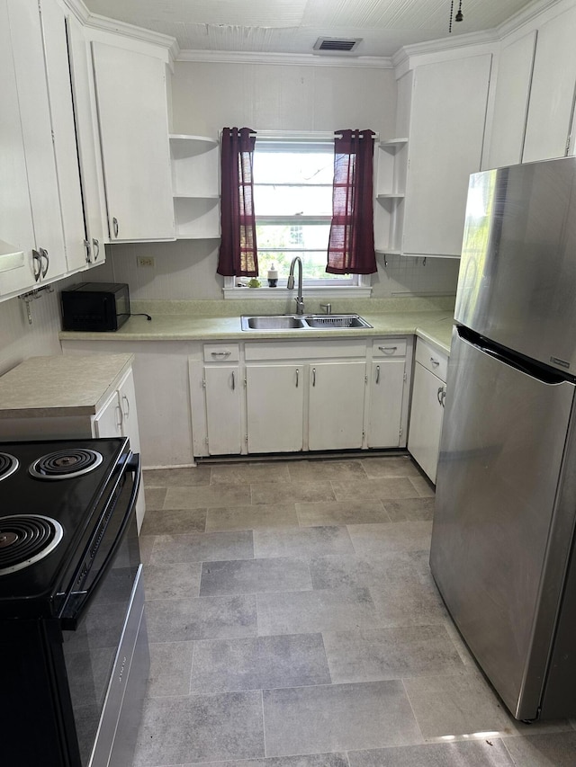 308 S Depot St, Bonifay, FL 32425 - kitchen featuring black appliances, open shelves, light countertops, white cabinets, and crown molding
