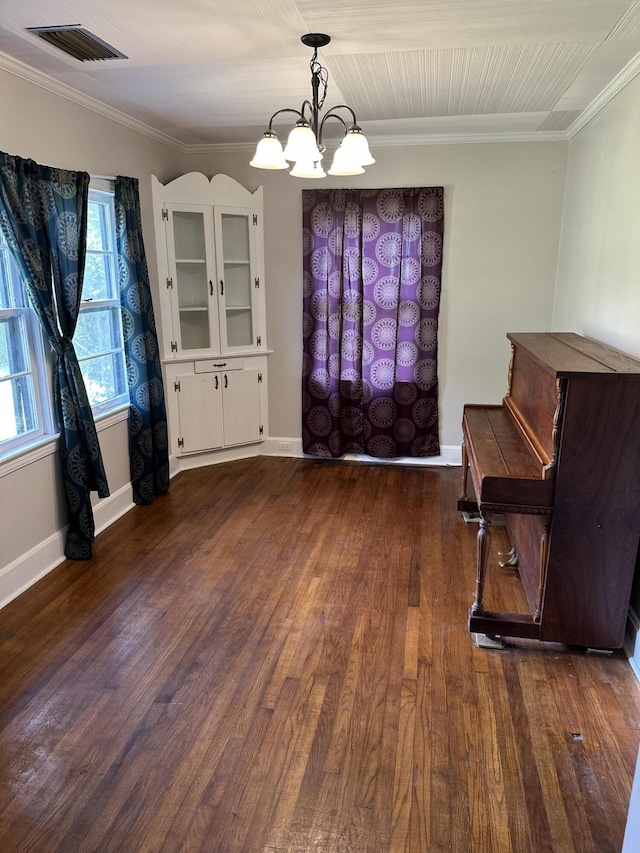 308 S Depot St, Bonifay, FL 32425 - unfurnished dining area featuring a chandelier, dark wood-type flooring, and ornamental molding