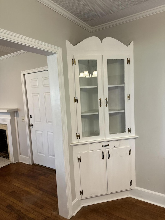 308 S Depot St, Bonifay, FL 32425 - detailed view of crown molding, wood finished floors, and a tiled fireplace