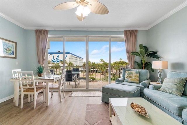 1515 SE Miracle Strip Pkwy Unit 305, Fort Walton Beach, FL 32548 - living room featuring ornamental molding, plenty of natural light, wood finished floors, and a ceiling fan