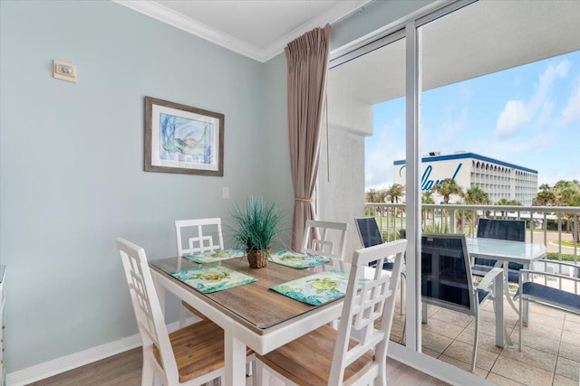 1515 SE Miracle Strip Pkwy Unit 305, Fort Walton Beach, FL 32548 - dining area featuring ornamental molding and wood finished floors