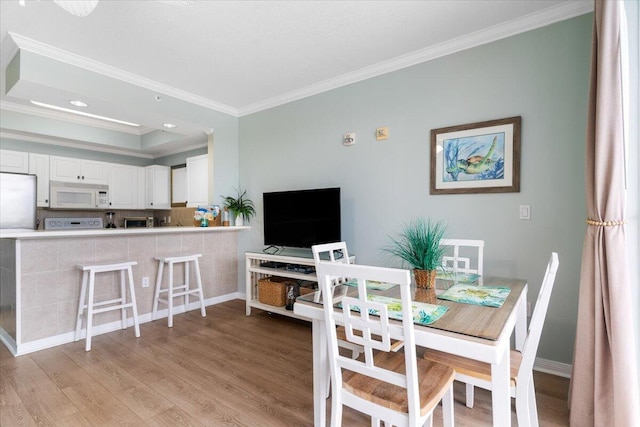 1515 SE Miracle Strip Pkwy Unit 305, Fort Walton Beach, FL 32548 - dining area featuring crown molding, light wood-style flooring, and recessed lighting