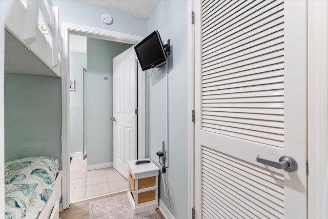 1515 SE Miracle Strip Pkwy Unit 305, Fort Walton Beach, FL 32548 - bathroom with tile patterned flooring and baseboards
