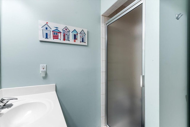 1515 SE Miracle Strip Pkwy Unit 305, Fort Walton Beach, FL 32548 - bathroom featuring a stall shower and vanity