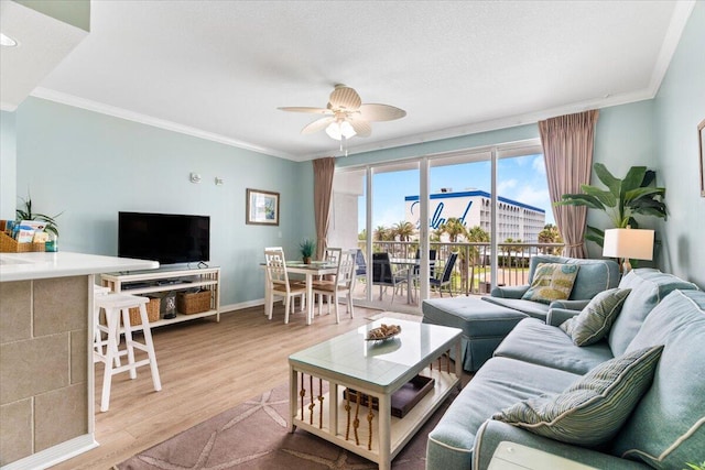 1515 SE Miracle Strip Pkwy Unit 305, Fort Walton Beach, FL 32548 - living area featuring a ceiling fan, wood finished floors, and crown molding