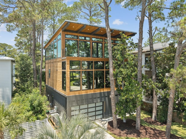 129 Oyster Lake Dr, Santa Rosa Beach, FL 32459 - rear view of property featuring an attached garage