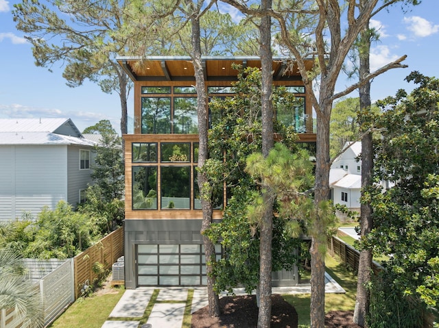 129 Oyster Lake Dr, Santa Rosa Beach, FL 32459 - view of home's exterior with driveway and an attached garage