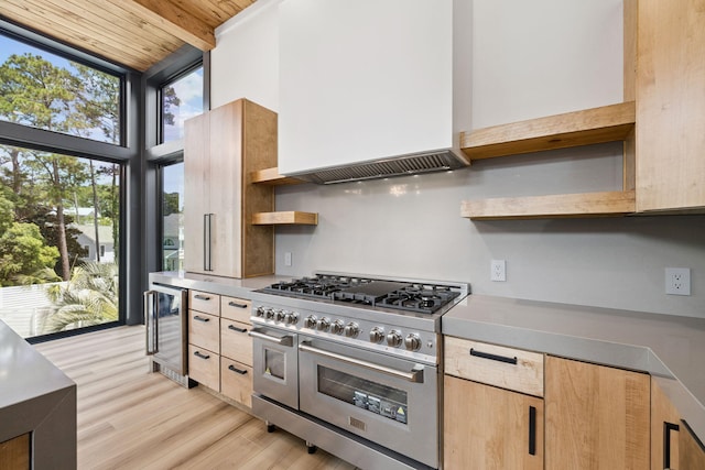 129 Oyster Lake Dr, Santa Rosa Beach, FL 32459 - kitchen featuring range with two ovens, open shelves, wine cooler, light brown cabinets, and light wood-style flooring