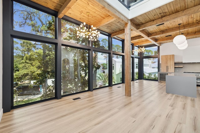 129 Oyster Lake Dr, Santa Rosa Beach, FL 32459 - unfurnished sunroom with a chandelier and beam ceiling