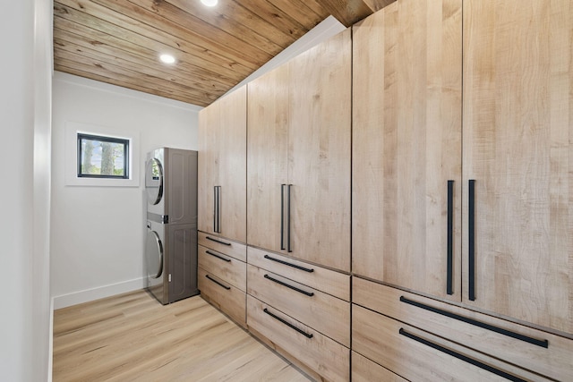129 Oyster Lake Dr, Santa Rosa Beach, FL 32459 - spacious closet featuring stacked washer and clothes dryer and light wood-type flooring