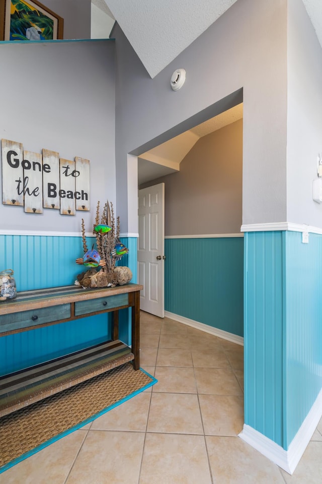 8520 Gulf Blvd Unit 29, Navarre, FL 32566 - hall with a wainscoted wall, tile patterned flooring, and a textured ceiling