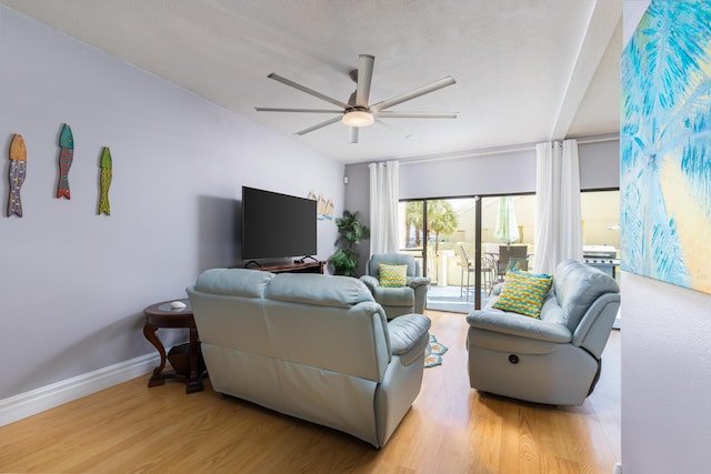 8520 Gulf Blvd Unit 29, Navarre, FL 32566 - living room with a ceiling fan and wood finished floors