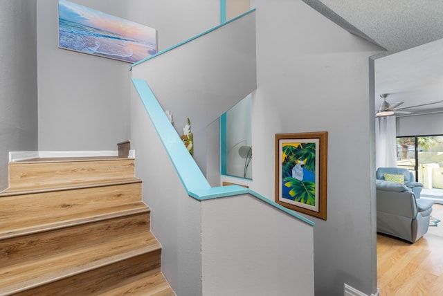 8520 Gulf Blvd Unit 29, Navarre, FL 32566 - staircase featuring wood finished floors and a ceiling fan