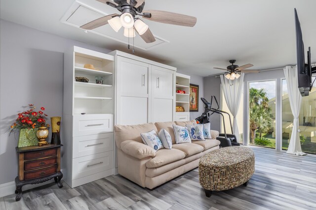 8520 Gulf Blvd Unit 29, Navarre, FL 32566 - living room featuring a ceiling fan, attic access, and light wood finished floors