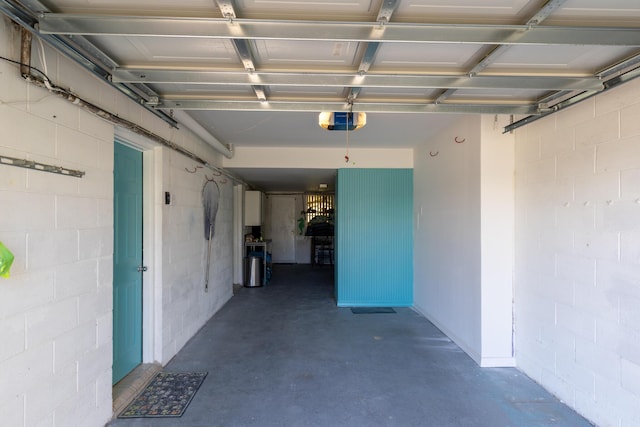 8520 Gulf Blvd Unit 29, Navarre, FL 32566 - garage with a garage door opener and concrete block wall