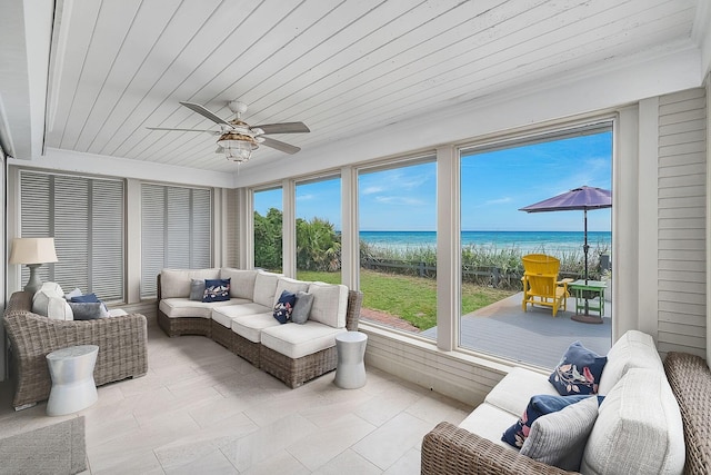 58 Montgomery St, Santa Rosa Beach, FL 32459 - sunroom with view of local beach, wood ceiling, a deck with water view, and tile patterned floors