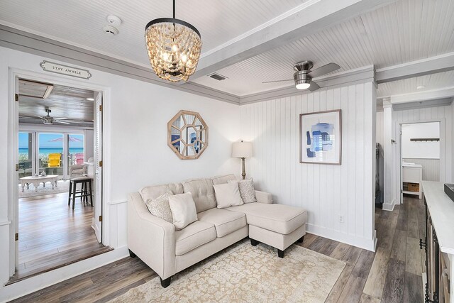 58 Montgomery St, Santa Rosa Beach, FL 32459 - living area with a ceiling fan, wood finished floors, a chandelier, ornamental molding, and beamed ceiling