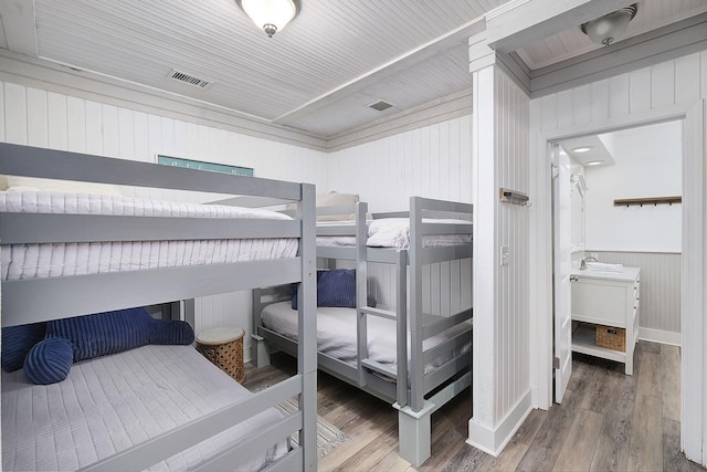 58 Montgomery St, Santa Rosa Beach, FL 32459 - bedroom with wood finished floors and wooden walls