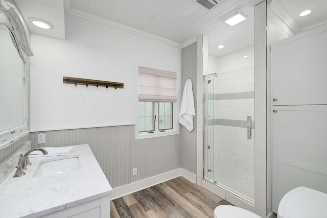 58 Montgomery St, Santa Rosa Beach, FL 32459 - bathroom featuring wood finished floors, vanity, a stall shower, crown molding, and a wainscoted wall