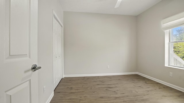 34 Herons Watch Way Unit 1202, Santa Rosa Beach, FL 32459 - unfurnished bedroom featuring wood finished floors, a closet, and ceiling fan
