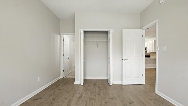 34 Herons Watch Way Unit 1202, Santa Rosa Beach, FL 32459 - unfurnished bedroom featuring light wood-style flooring and a closet