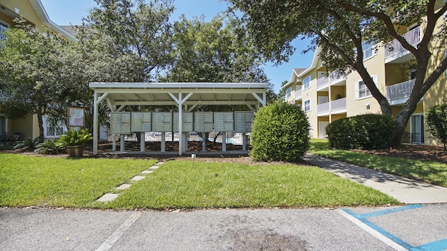34 Herons Watch Way Unit 1202, Santa Rosa Beach, FL 32459 - view of property's community with mail area, a lawn, and a carport