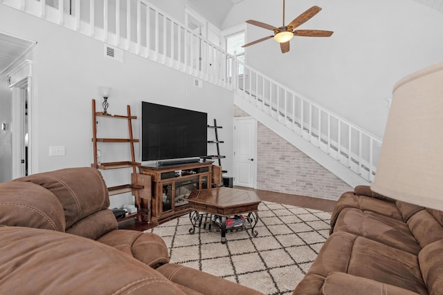 6539 Robar Tesora St, Navarre, FL 32566 - living room with a high ceiling, stairs, and ceiling fan