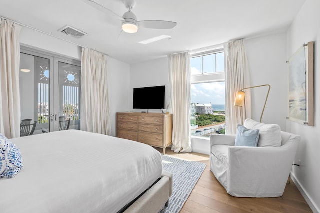 20 Mark Twain Ln Unit 402, Inlet Beach, FL 32461 - bedroom featuring access to exterior, wood finished floors, and ceiling fan
