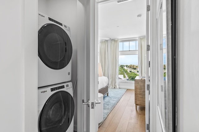 20 Mark Twain Ln Unit 402, Inlet Beach, FL 32461 - washroom with stacked washer / drying machine and light wood finished floors