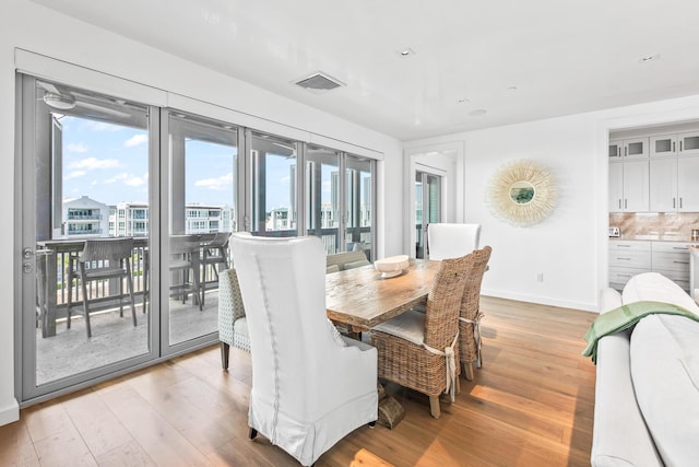 20 Mark Twain Ln Unit 402, Inlet Beach, FL 32461 - dining room with light wood-style flooring and baseboards
