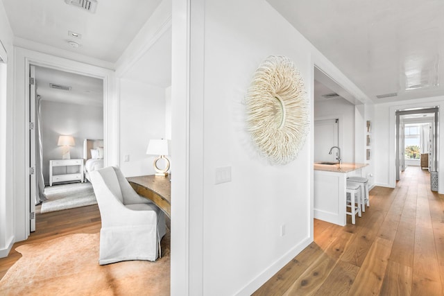 20 Mark Twain Ln Unit 402, Inlet Beach, FL 32461 - hallway featuring hardwood / wood-style flooring and a desk