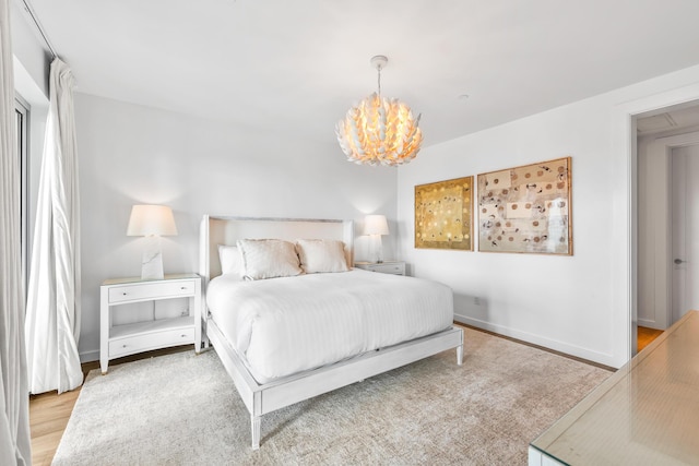 20 Mark Twain Ln Unit 402, Inlet Beach, FL 32461 - bedroom with a chandelier and wood finished floors