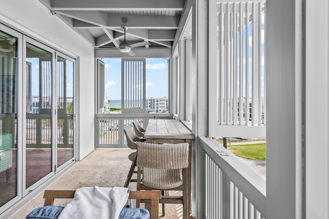20 Mark Twain Ln Unit 402, Inlet Beach, FL 32461 - sunroom featuring a ceiling fan, beam ceiling, and a water view