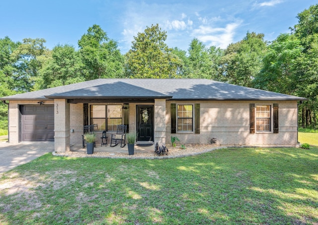 313 Lakeview Dr, Crestview, FL 32536 - ranch-style home with brick siding, an attached garage, a shingled roof, a front yard, and concrete driveway