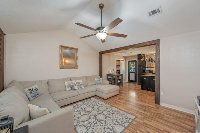 313 Lakeview Dr, Crestview, FL 32536 - living area with a ceiling fan, lofted ceiling, and light wood-type flooring