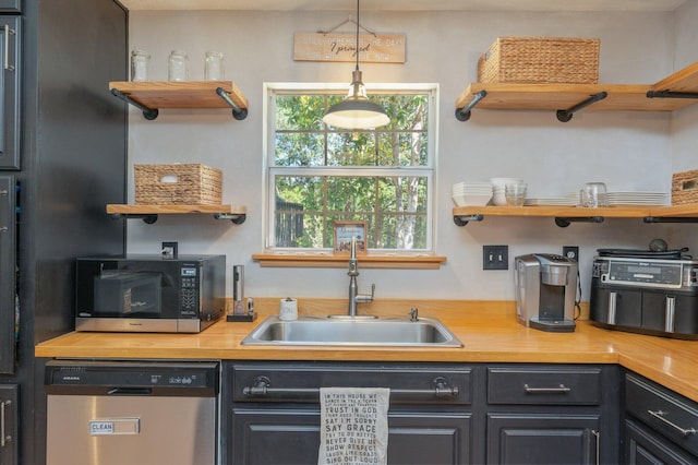 313 Lakeview Dr, Crestview, FL 32536 - kitchen with dishwasher, open shelves, black microwave, and wood counters