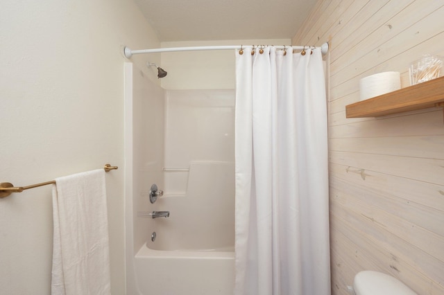 313 Lakeview Dr, Crestview, FL 32536 - bathroom featuring wooden walls and shower / bath combination with curtain
