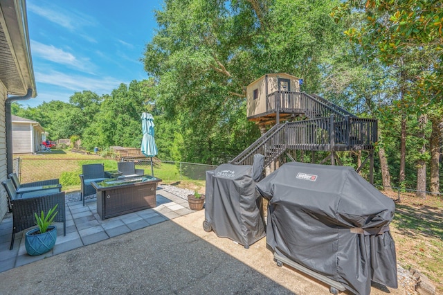 313 Lakeview Dr, Crestview, FL 32536 - view of patio / terrace with grilling area, an outdoor living space, stairway, and view of wooded area