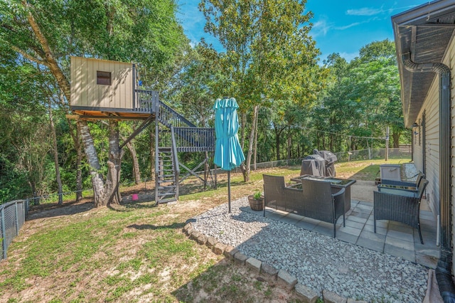 313 Lakeview Dr, Crestview, FL 32536 - fenced backyard featuring stairs, a patio area, and an outdoor hangout area