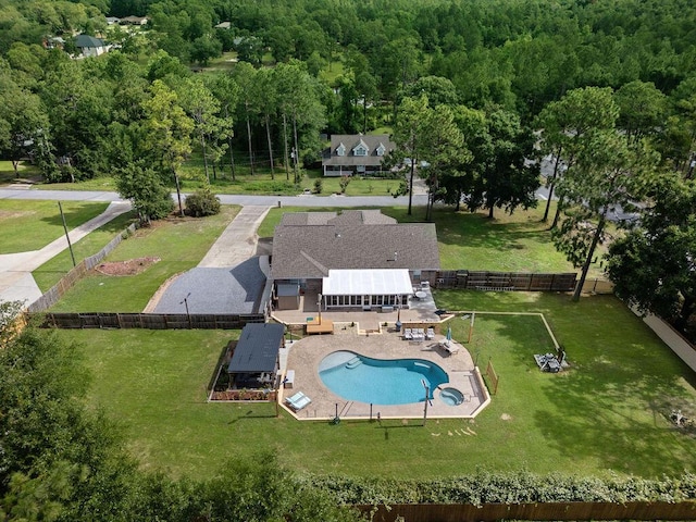 131 Wedgewood Ln, Crestview, FL 32536 - aerial view of property and surrounding area featuring a pool and a heavily wooded area