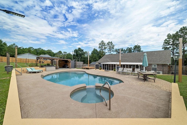 131 Wedgewood Ln, Crestview, FL 32536 - view of swimming pool with an in-ground hot tub, a gazebo, a fenced backyard, and a patio