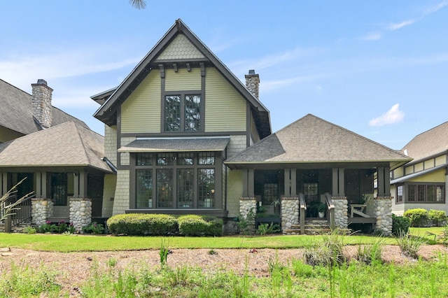 1510 Match Point Ln Unit 303, Panama City Beach, FL 32413 - back of property with a porch and a shingled roof