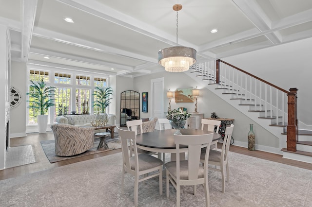 1510 Match Point Ln Unit 303, Panama City Beach, FL 32413 - dining room with stairs, coffered ceiling, wood finished floors, a chandelier, and beamed ceiling