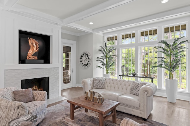 1510 Match Point Ln Unit 303, Panama City Beach, FL 32413 - living area featuring a brick fireplace, recessed lighting, wood finished floors, and beam ceiling