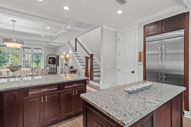 1510 Match Point Ln Unit 303, Panama City Beach, FL 32413 - kitchen featuring recessed lighting, light stone counters, light wood-type flooring, coffered ceiling, and beam ceiling
