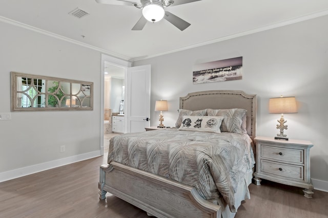 1510 Match Point Ln Unit 303, Panama City Beach, FL 32413 - bedroom with wood finished floors, ornamental molding, ensuite bathroom, and a ceiling fan