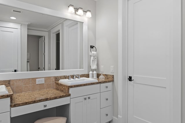1510 Match Point Ln Unit 303, Panama City Beach, FL 32413 - bathroom with vanity and ornamental molding
